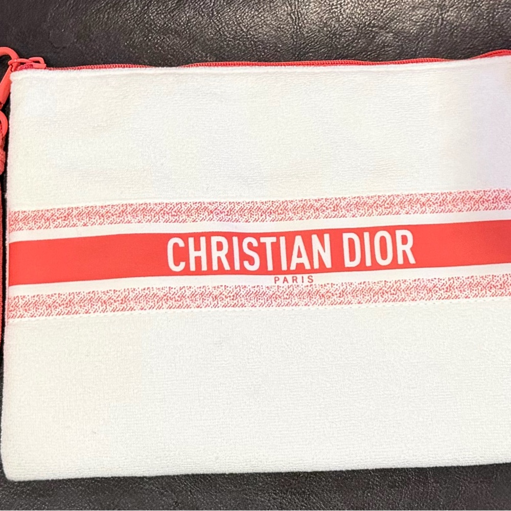 Christian Dior terry zipper pouch with wrist handle.